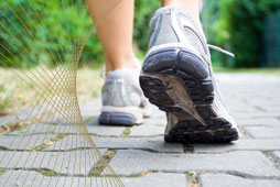 close-up of feet walking in running trainers